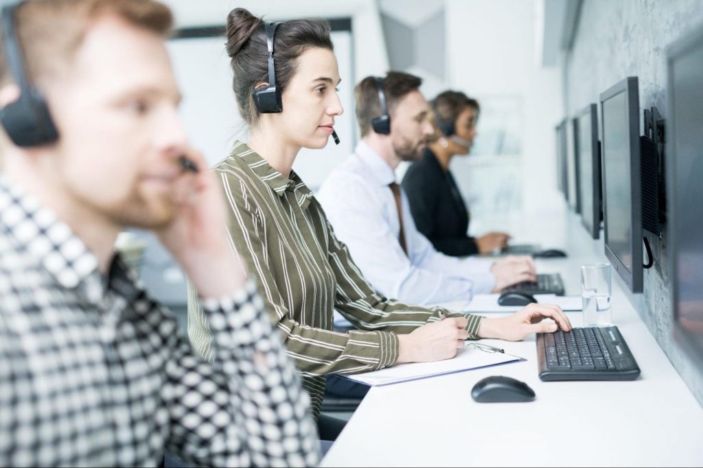 Cal center employees are working on answering calls from customers