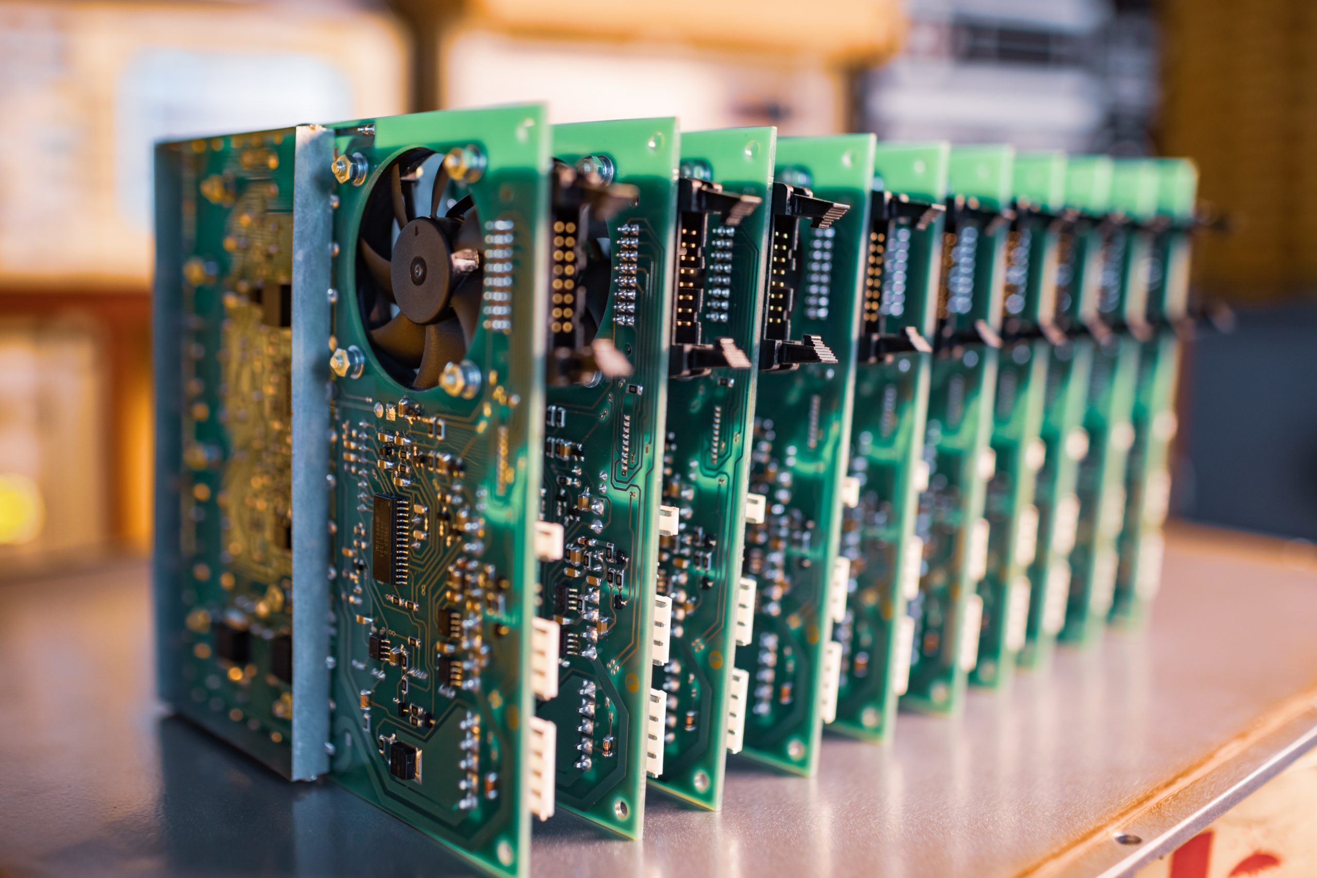 Close-up green embedded microcircuits are stacked in box to prepare for the further in factory for production of equipment