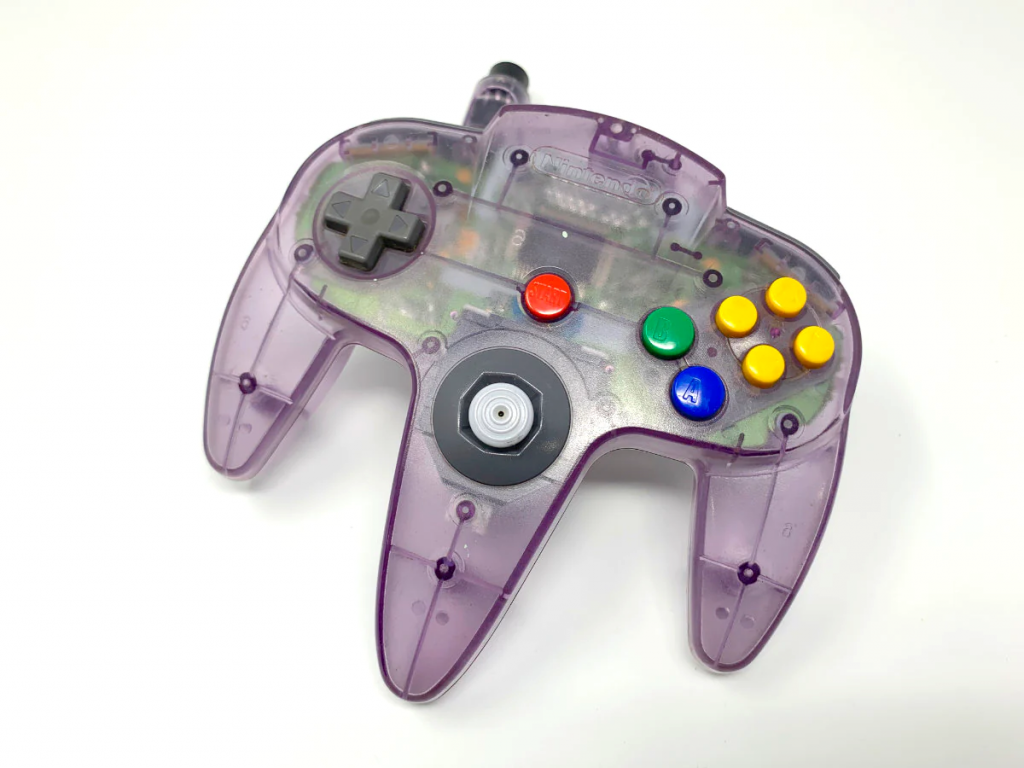 An image of a purple Nintendo-64 controller, wherein a printed circuit board is visible beneath the clear case.