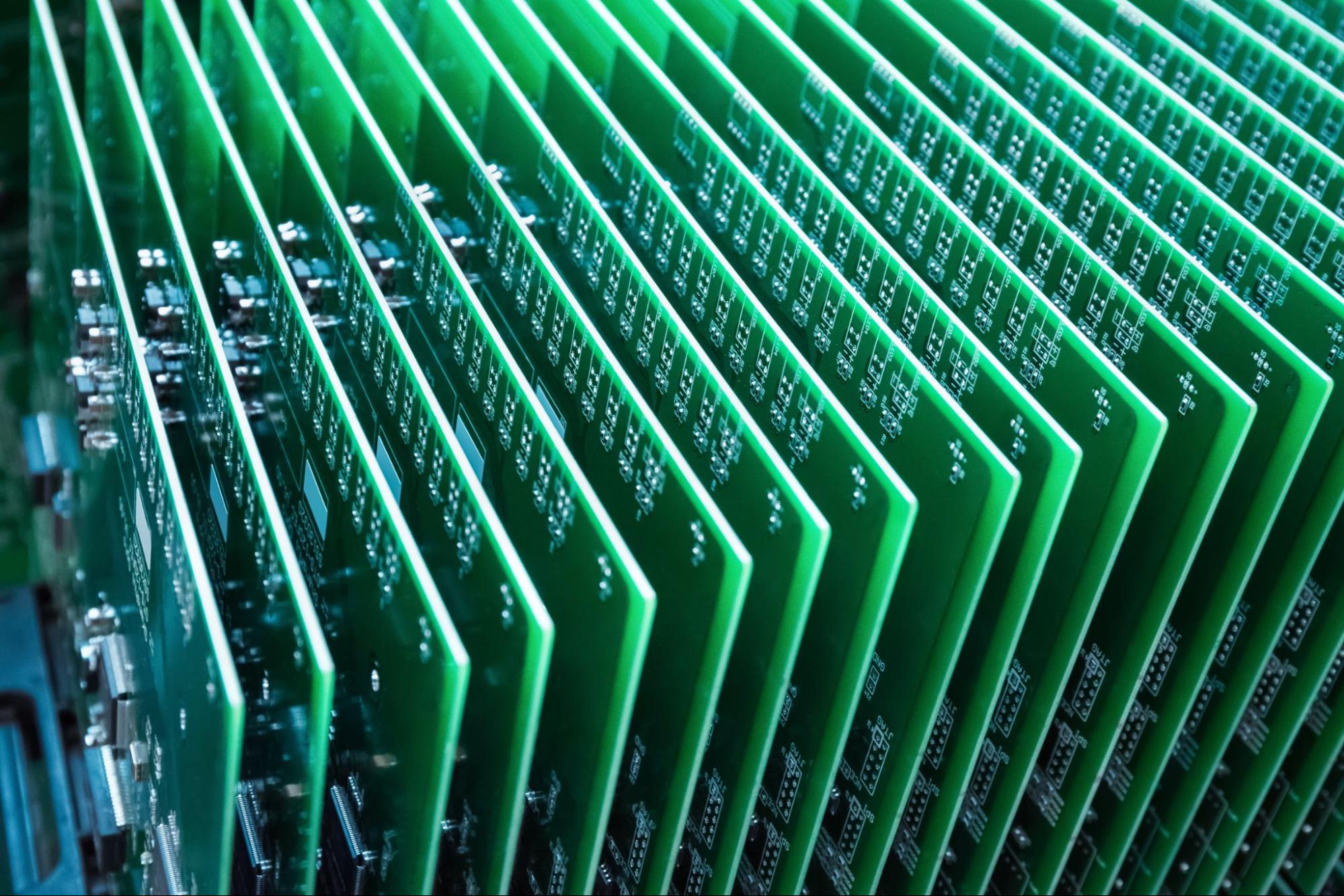 green communication circuit board closeup in a server room