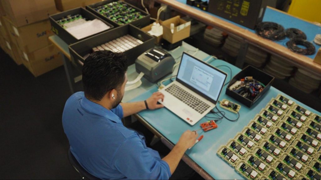 A design engineer examining the design of a new printed circuit board