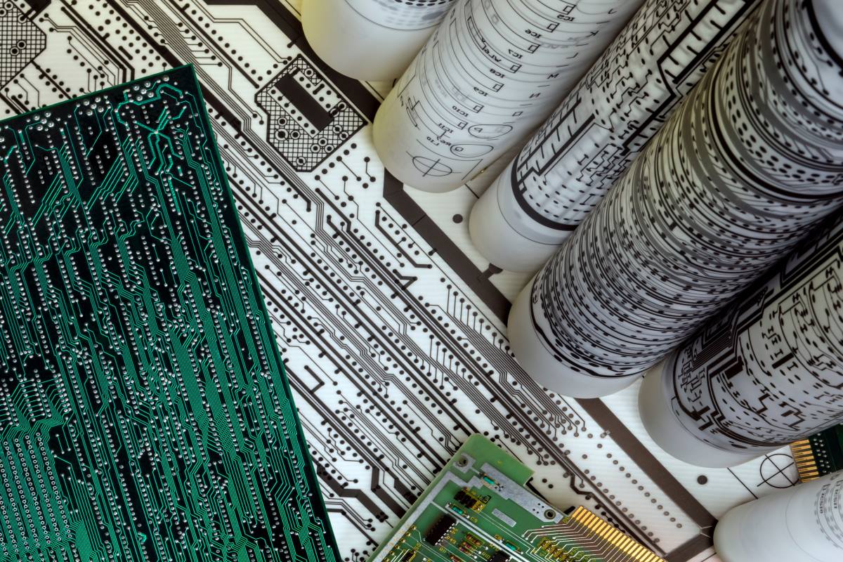 a table filled with printed circuit boards